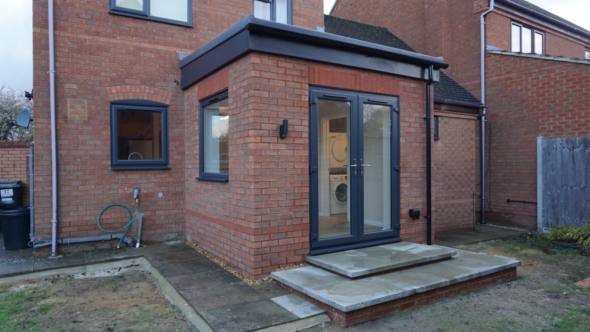 Modern single storey rear extension in Loughton with large view window and French doors